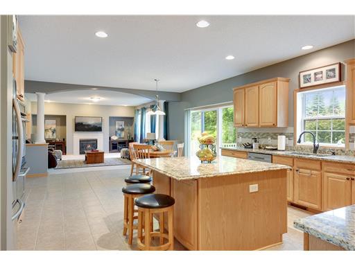 6465 Hedgecroft Avenue S, Cottage Grove, MN 55016 listed by Jason Lange, RE/MAX Results Kitchen and open living area at 6465 Hedgecroft Avenue S in Cottage Grove, Minnesota