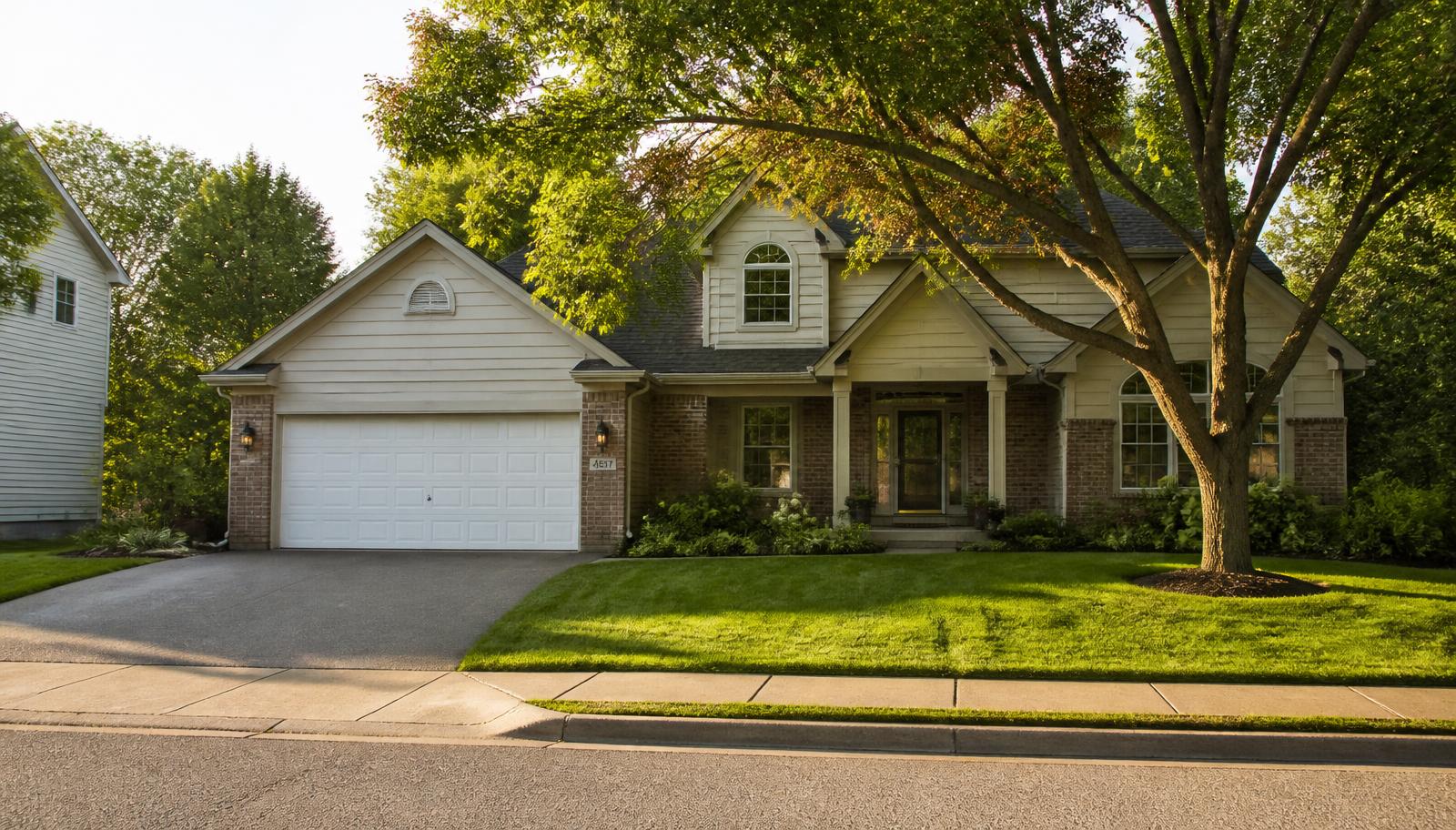 Single family home exterior on a quiet Woodbury, Minnesota neighborhood street in late summer light