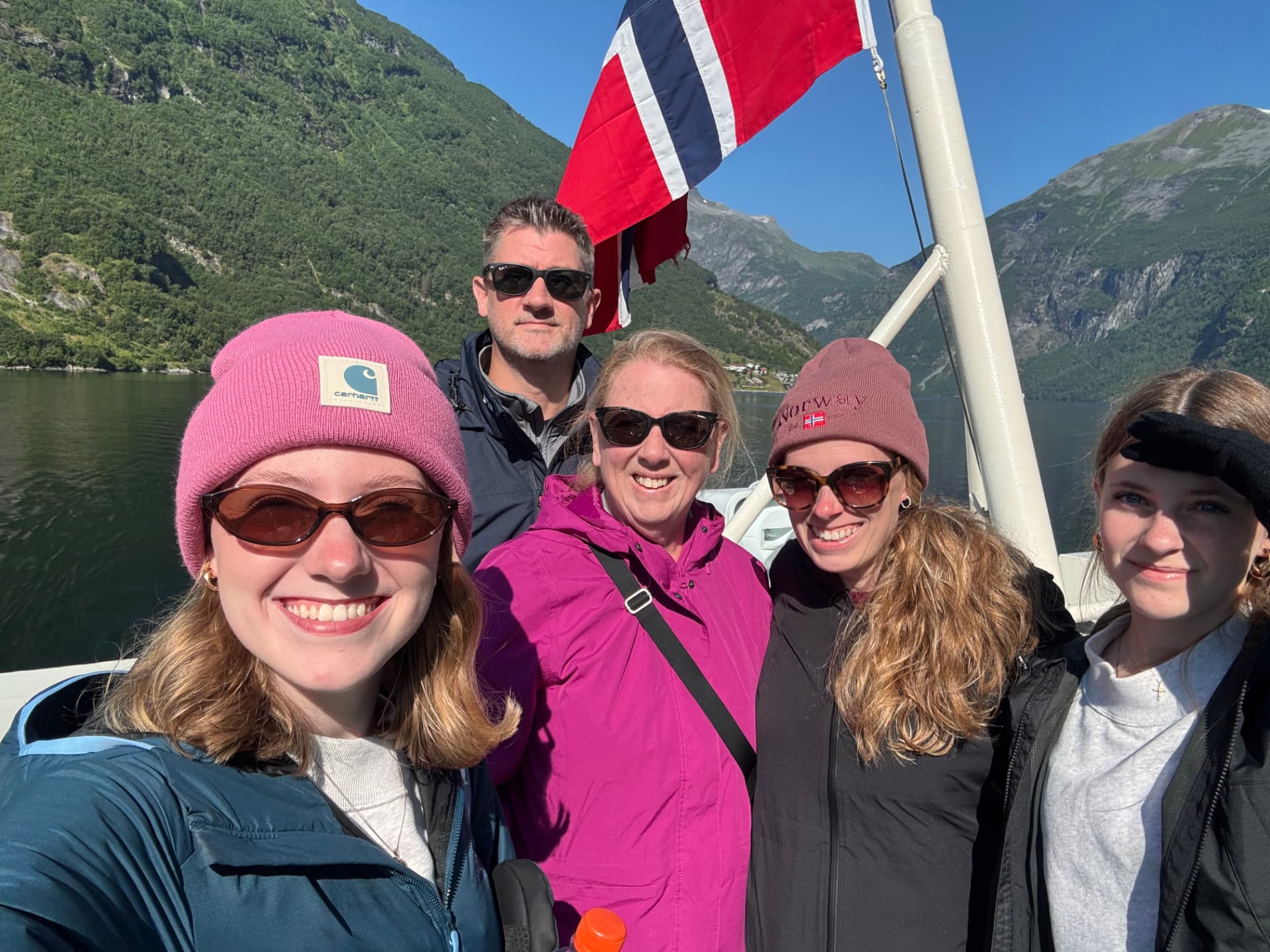 Jason Lange with his wife, daughters, and mother on a boat in Norway